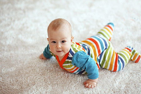 Infant on the Carpet - Pediatric Dentist in Charlotte, Rock Hill and Gastonia